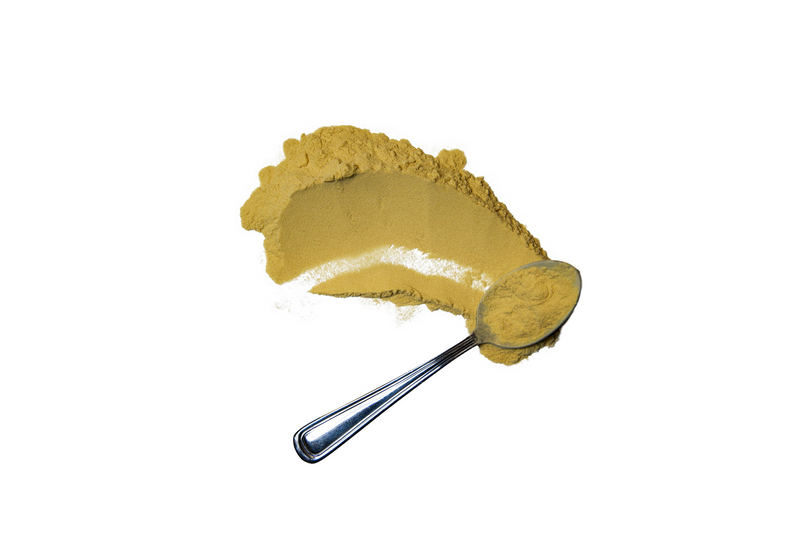 Spoon with MonkVee Pure monk fruit extract powder on white background